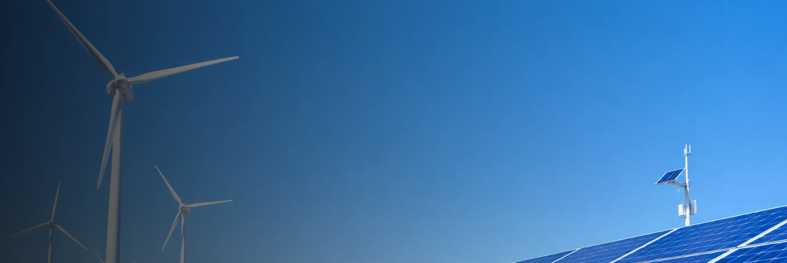 Wind turbines and solar arrays supporting industrial power systems